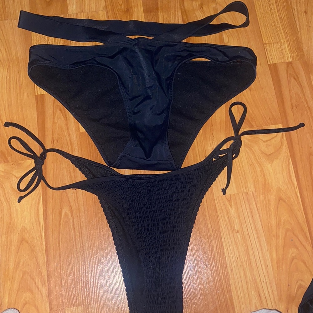 Two black bathing suit bottoms